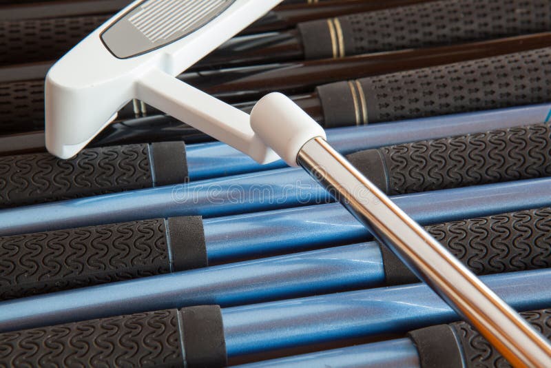 Golf putter and golf clubs stock image. Image of field 31522413