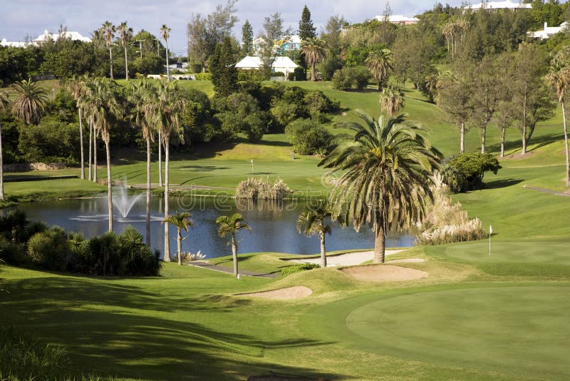 Golf green and pond at a luxury resort on a tropical island. Golf green and pond at a luxury resort on a tropical island