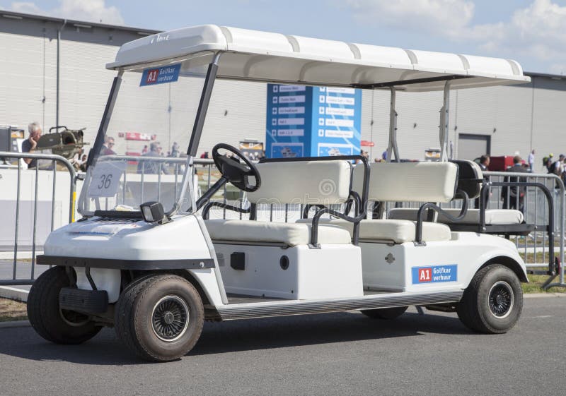Golfcar stands on airport in berlin royalty free stock photography Golfcar stands on airport in berlin royalty free stock photography