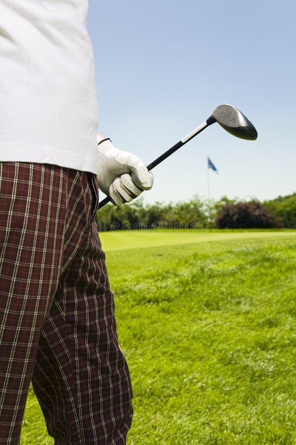 Golf club: golfer moving to the next hole. Golf club: golfer moving to the next hole