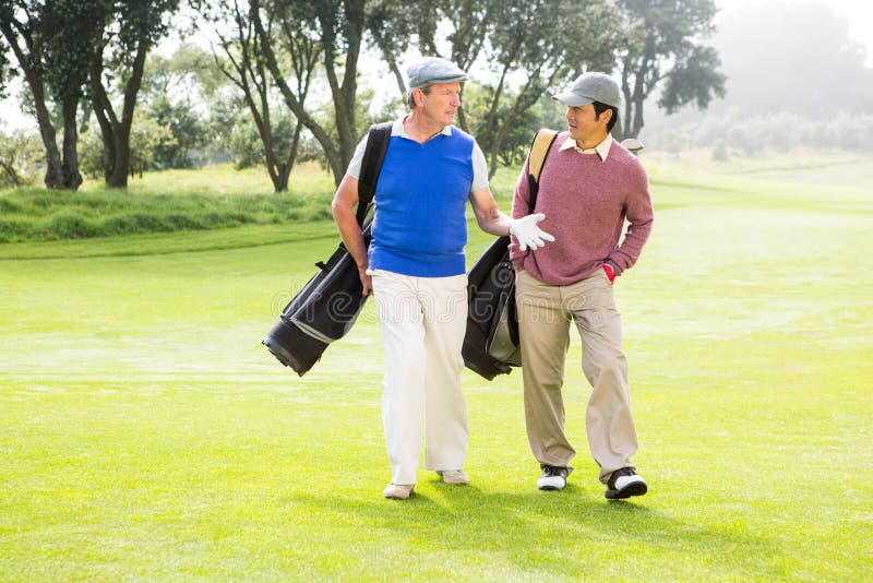 Golfer Friends Walking and Chatting Stock Photo Image of cheerful