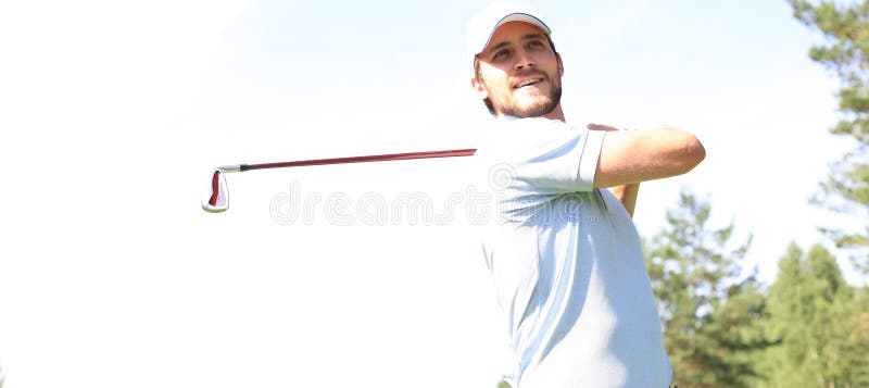 Golfer hits an fairway shot towards the club house royalty free stock image Golfer hits an fairway shot towards the club house royalty free stock image