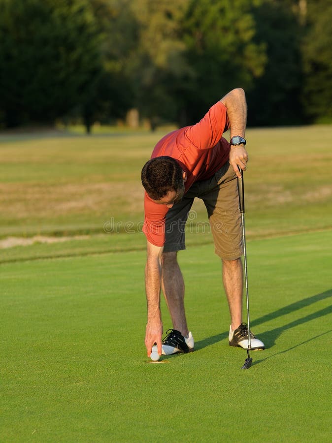 3+ Golfer picking up ball Free Stock Photos StockFreeImages
