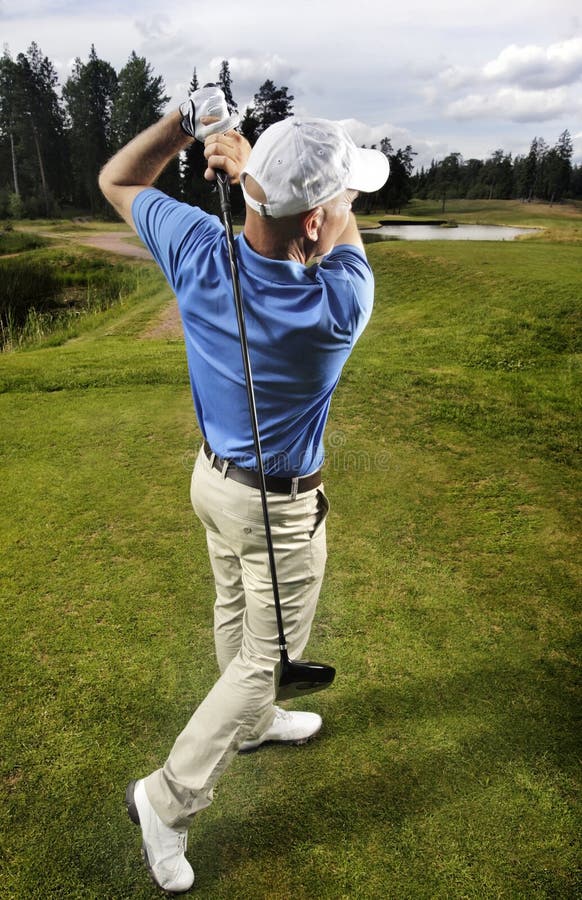 Golfer Shooting a Golf Ball Stock Photo Image of recreation, fashion