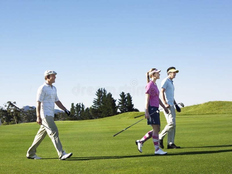 Golfers Walking on Golf Course Stock Photo Image of caucasian, player Golfers Walking on Golf Course Stock Photo Image of caucasian, player