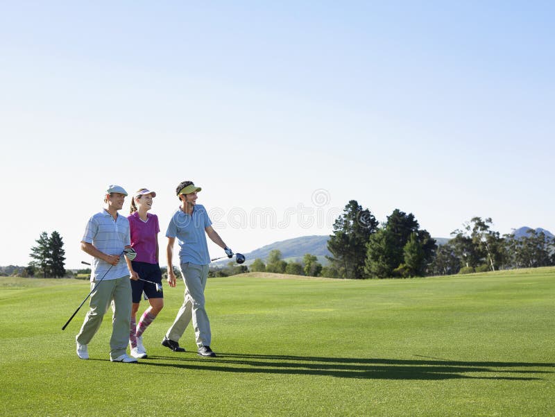 Golfers Walking on Golf Course Stock Image Image of people, enjoyment