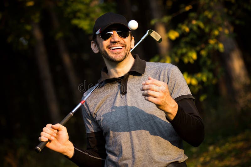 Golfista sonriente juguetón fotografía de archivo Golfista sonriente juguetón fotografía de archivo