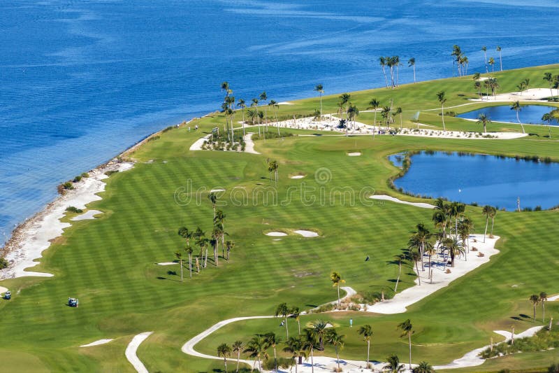 Waterfront golf course in Florida. Sports grounds with green grass in Boca Grande, small town on Gasparilla Island. Waterfront golf course in Florida. Sports grounds with green grass in Boca Grande, small town on Gasparilla Island.