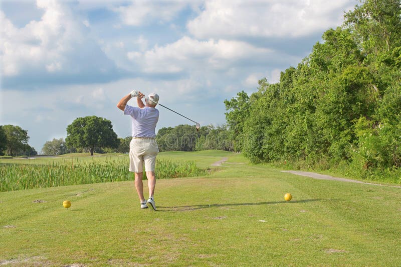 Senior golfer displaying proper posture of a golf swing. Senior golfer displaying proper posture of a golf swing