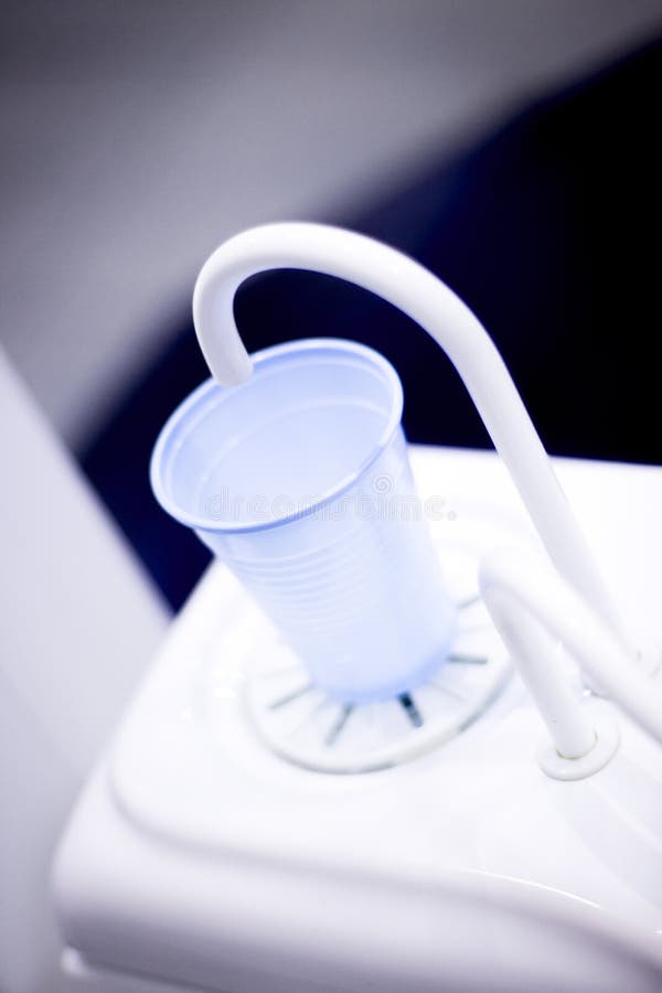 Dentists dental rinse tap and cup in clinic photo. Dentists dental rinse tap and cup in clinic photo.
