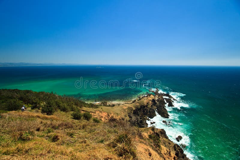 Waves Crashing on Rocky Pennisula at Byron Bay Lighthouse Park in New South Wales, AU. Waves Crashing on Rocky Pennisula at Byron Bay Lighthouse Park in New South Wales, AU