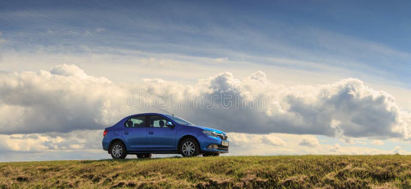 GOMEL, BELARUS - 16 April 2017: Beautiful blue car against the sky with clouds