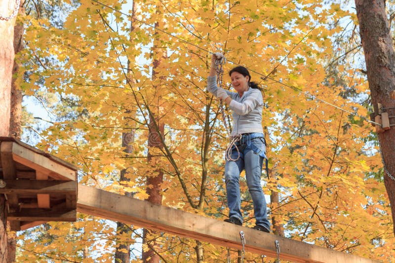 Gomel, Belarus - OCTOBER 5, 2014: Rope town for a family holiday in the countryside. Family competition to overcome aerial obstacl royalty free stock photos Gomel, Belarus - OCTOBER 5, 2014: Rope town for a family holiday in the countryside. Family competition to overcome aerial obstacl royalty free stock photos