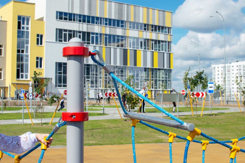 Gomel, Belarus - September 1, 2021: Newly built school No. 75 in Gomel. View from the outside, next to the building there is a large children&#x27;s playground. Gomel, Belarus - September 1, 2021: Newly built school No. 75 in Gomel. View from the outside, next to the building there is a large children&#x27;s playground.