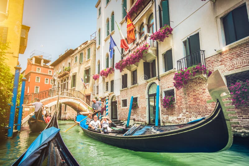 Gondolas on canal in Venice, Italy with retro vintage Instagram