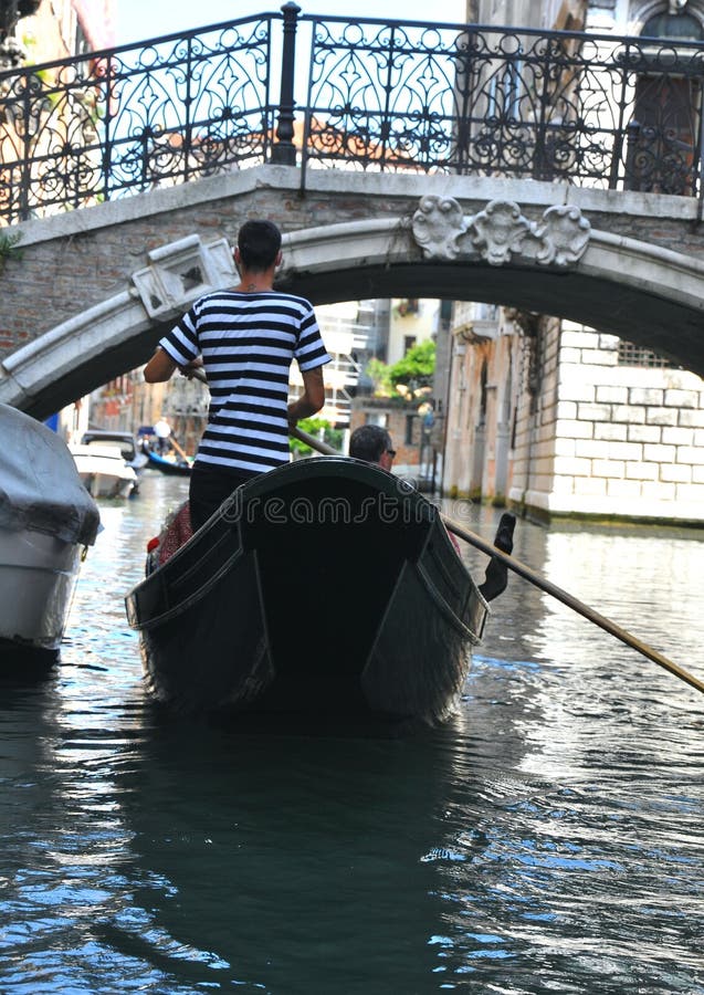 Gondolier in Venice , Italy