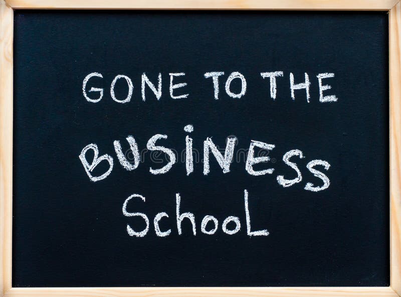 Gone to the business school message written with white chalk on wooden frame blackboard