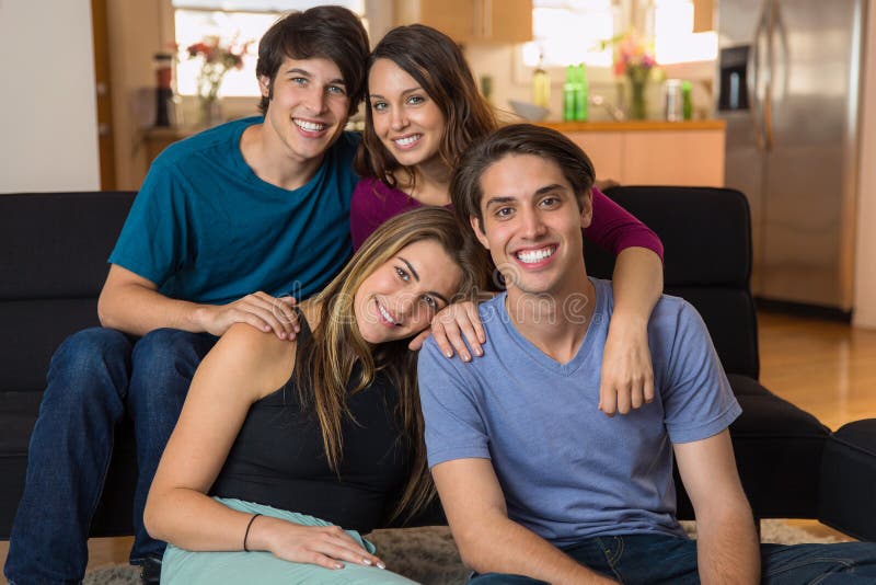 Good looking attractive friends embracing and enjoying each other's company with perfect smiles stock photos Good looking attractive friends embracing and enjoying each other's company with perfect smiles stock photos