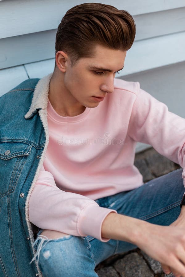 Premium Photo  Nice stylish young hipster man in a denim jacket in a black  t-shirt in sunglasses with a hairstyle stands near a vintage metal red van.  urban trendy guy model