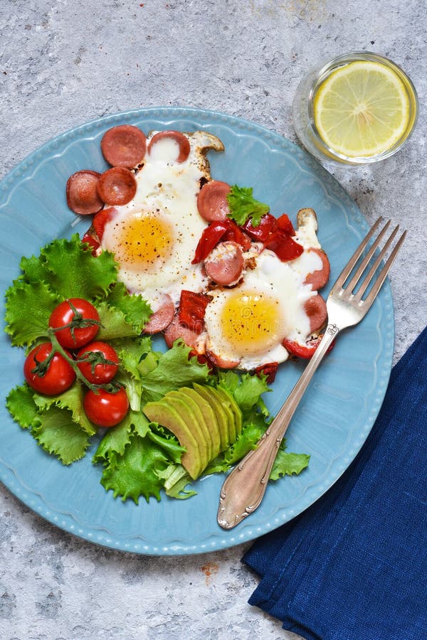 Good Morning! Breakfast Fried Eggs with Sausage and Pepper. Stock Photo