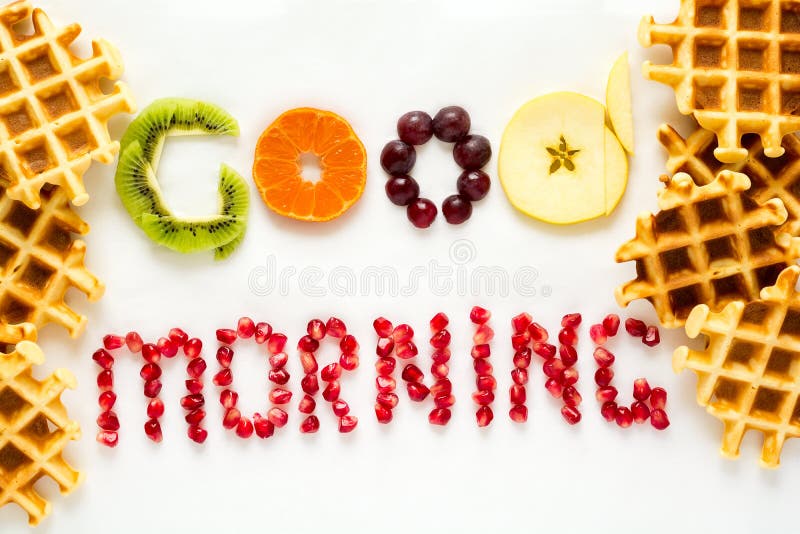 Good morning concept. `Good morning` words laid out with pieces of fruit and pomegranate seeds royalty free stock photo Good morning concept. `Good morning` words laid out with pieces of fruit and pomegranate seeds royalty free stock photo