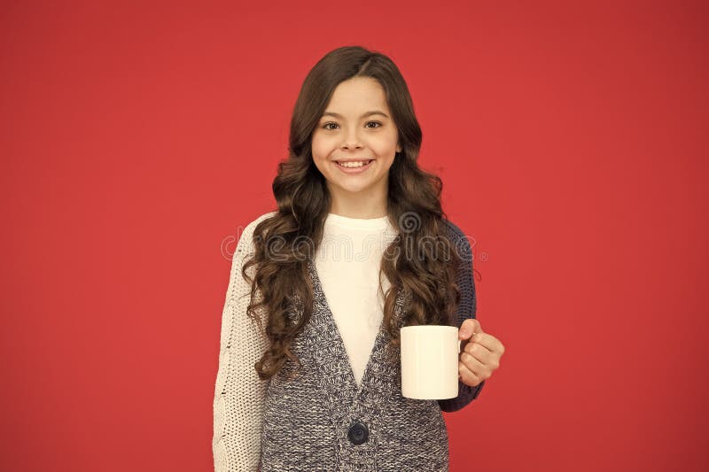 Good morning. Drink enough water. Girl kid hold mug red background. Child hold mug. Drinking tea juice cocoa. Relaxing