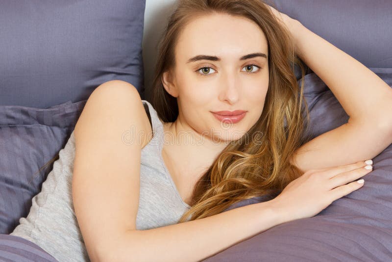 Good Morning Positive Beautiful Woman Smiling At Camera Lying In Bed