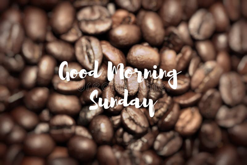 Good Morning Sunday. Closeup of coffee beans background.