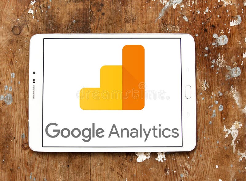 Logo of Google Analytics on samsung tablet on wooden background. Google Analytics is a freemium web analytics service offered by Google that tracks and reports website traffic. Logo of Google Analytics on samsung tablet on wooden background. Google Analytics is a freemium web analytics service offered by Google that tracks and reports website traffic