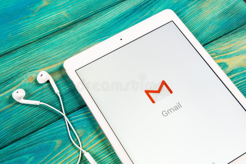 Google Gmail application icon on Apple iPad smartphone screen close-up. Gmail app icon. Gmail is popular Internet online e-mail. stock image