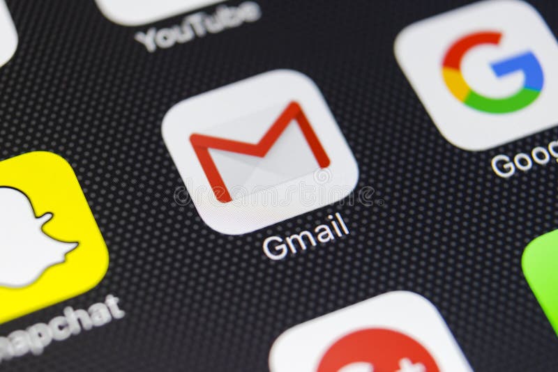 Google Gmail application icon on Apple iPhone 8 smartphone screen close-up. Gmail app icon. Gmail is the most popular Internet royalty free stock photo