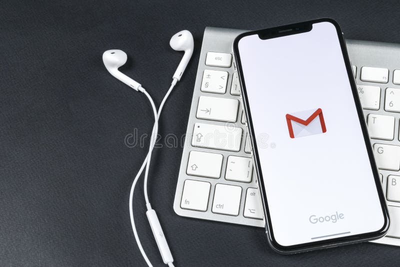 Google Gmail application icon on Apple iPhone X smartphone screen close-up. Gmail app icon. Gmail is popular Internet online e-ma royalty free stock photography