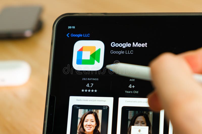 Google Meet Logo Shown by Apple Pencil on the IPad Pro Tablet Screen. Man Using Application on