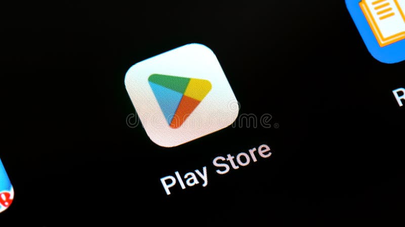 Google Play Store app application software logo icon on a smartphone tablet mobile phone device display, screen macro, extreme closeup detail, nobody. Android apps