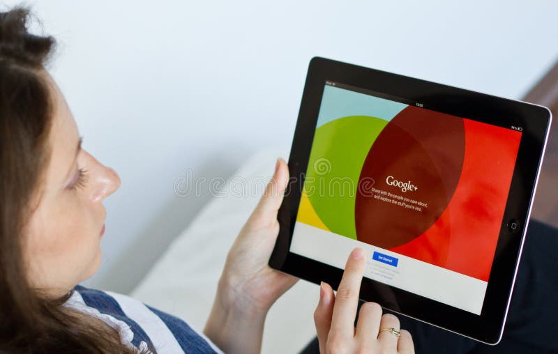 Woman logs in on Google Plus social network on digital tablet