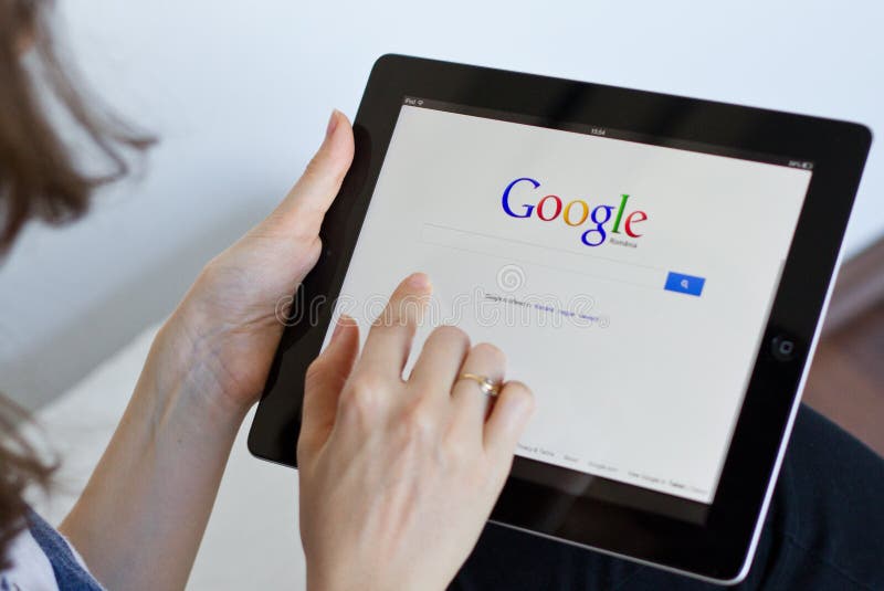 Woman performs a Google search on digital tablet