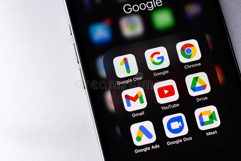 Google services Google One, Google, Gmail, Chrome, Ads icons apps on screen smartphone iPhone closeup stock photography