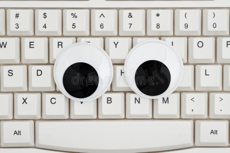 Googly eyes on a keyboard stock image. Image of technology 127786529