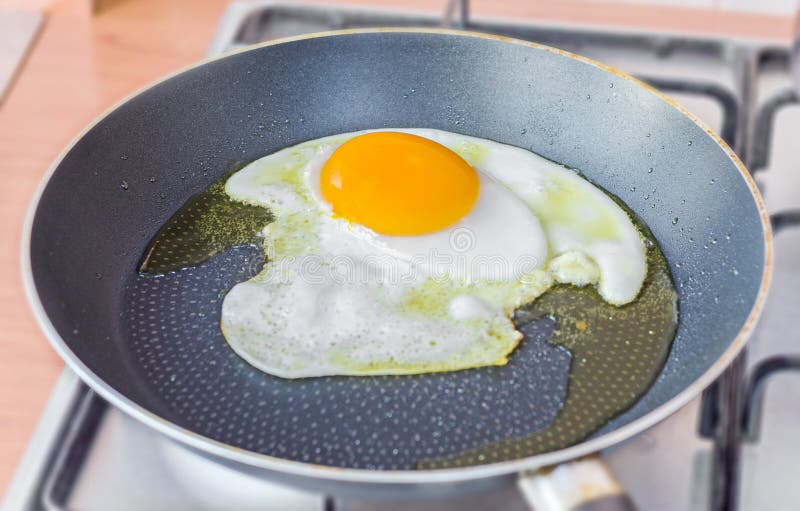 Goose Large Egg Fried in a Pan, Olive Oil, Close Up, Isolated. Stock