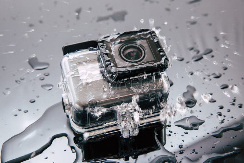 GoProheld 5 actiecamera in waterdicht geval stock foto's GoProheld 5 actiecamera in waterdicht geval stock foto's