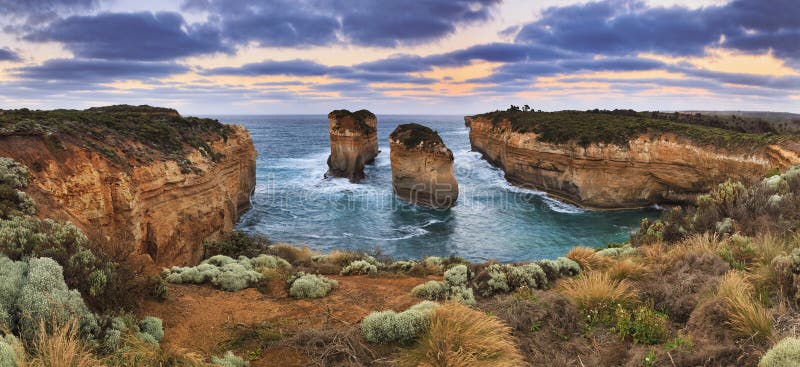 Great ocean road landmarks in VIctoria, Australia. Panoramic view on 2 disconnected rocks in a bay from Loch Ard GOrge lookout in Port Campbell national park. Great ocean road landmarks in VIctoria, Australia. Panoramic view on 2 disconnected rocks in a bay from Loch Ard GOrge lookout in Port Campbell national park