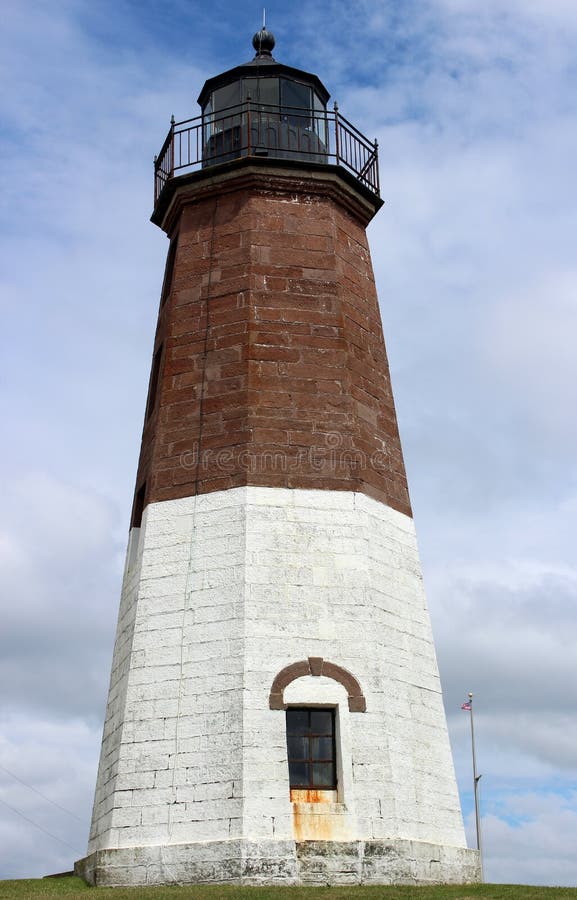 Expressive skies of blue and cloud cover highlight Point Judith Lighthouse, Rhode Island, 2018