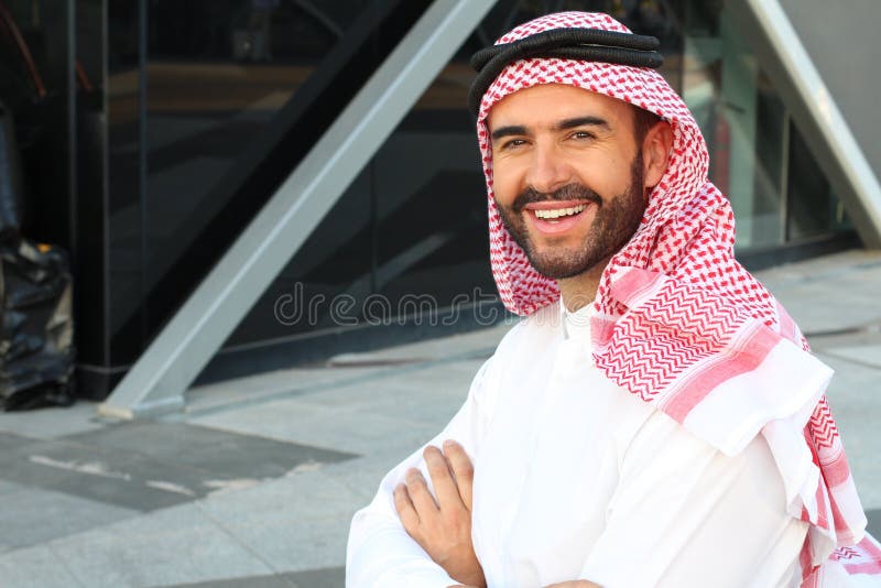 Gorgeous Arabic businessman smiling in office space