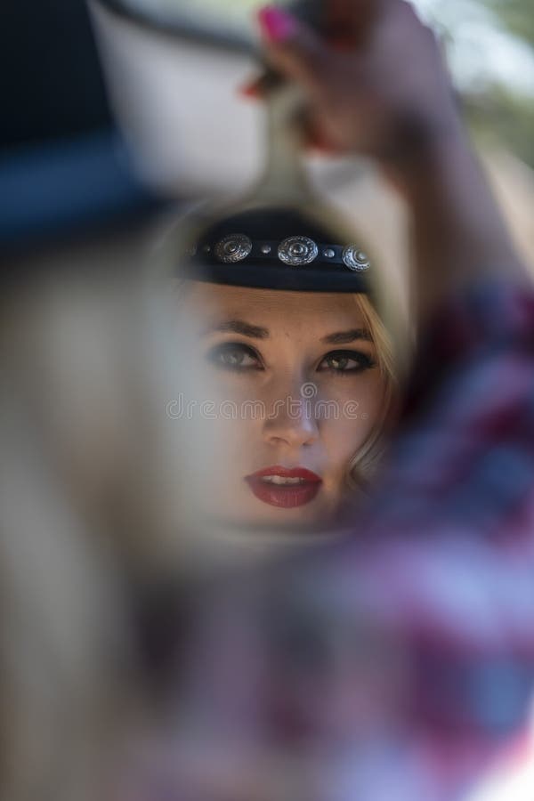 A Lovely Blonde Model Dressed As A Cowgirl Enjoys The American West