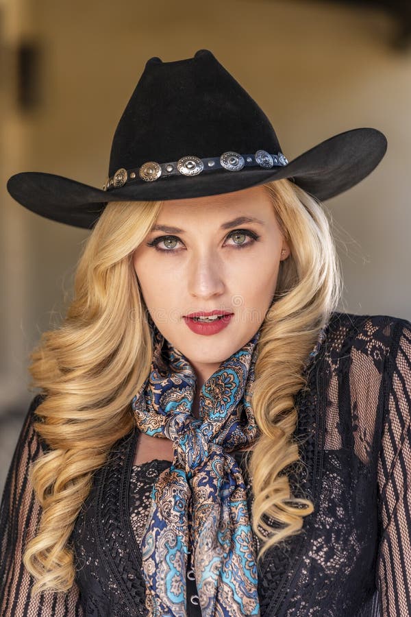 A Lovely Blonde Model Dressed As a Cowgirl Enjoys the American West ...