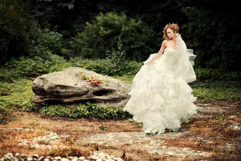 Gorgeous bride in a lush white dress is dancing. royalty free stock photography Gorgeous bride in a lush white dress is dancing. royalty free stock photography