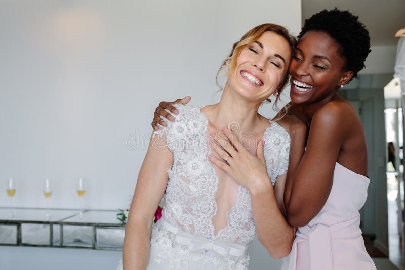 Cheerful bride and bridesmaid on the wedding day royalty free stock photo Cheerful bride and bridesmaid on the wedding day royalty free stock photo