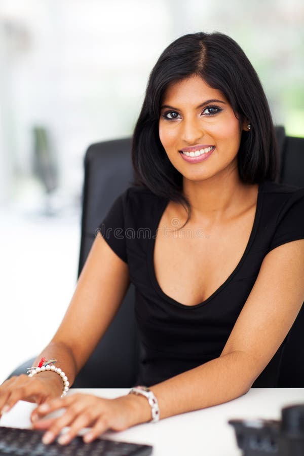 Gorgeous businesswoman typing royalty free stock photo