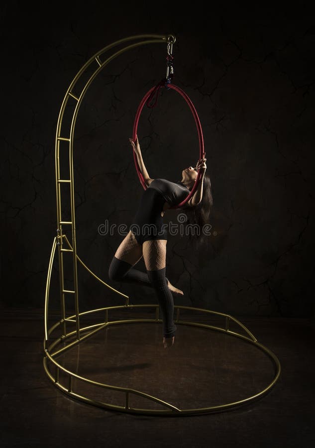 gorgeous girl aerial acrobat dark suit performs acrobatic elements portable air ring stage light gorgeous girl 148468654