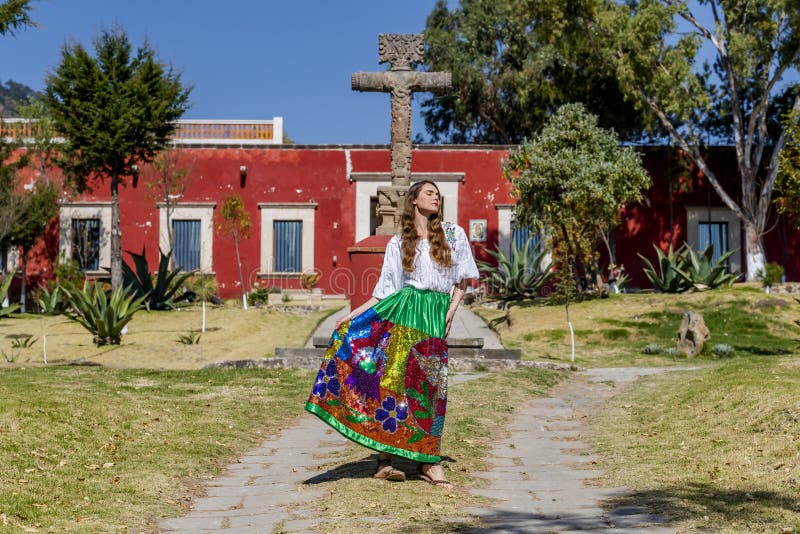 A gorgeous Hispanic Brunette model poses outdoors at a Mexican hacienda. A gorgeous Hispanic Brunette model poses outdoors at a Mexican hacienda